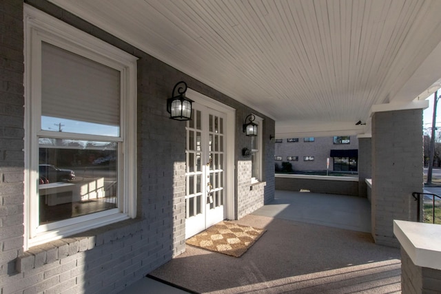 view of patio / terrace featuring covered porch and french doors