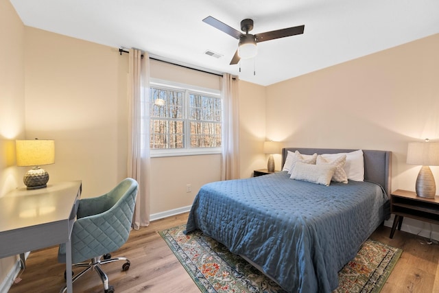 bedroom with ceiling fan and light wood-type flooring