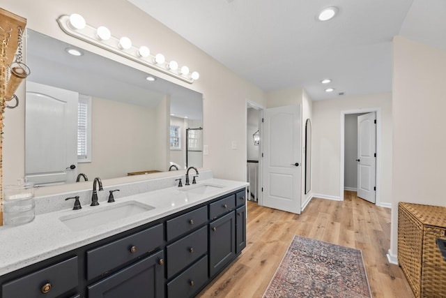 bathroom featuring hardwood / wood-style floors and vanity