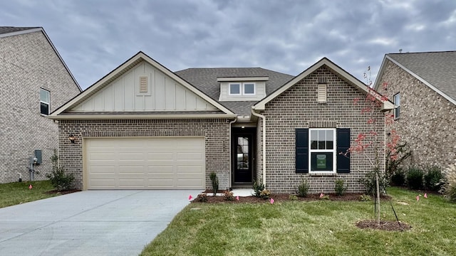 view of front facade with a front yard and a garage