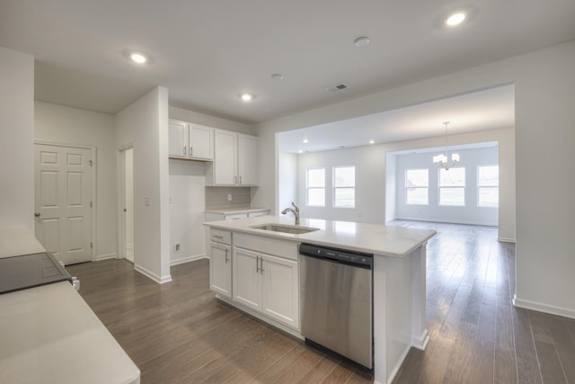 kitchen with dishwasher, a center island with sink, a notable chandelier, sink, and white cabinetry