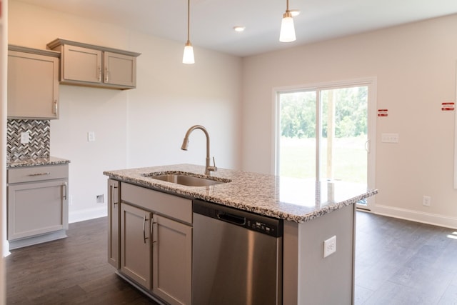 kitchen with dishwasher, tasteful backsplash, a sink, and gray cabinetry