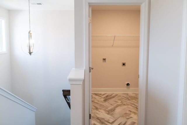 laundry area with visible vents and hookup for an electric dryer