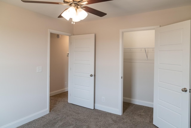 unfurnished bedroom with carpet floors, a ceiling fan, baseboards, and a closet