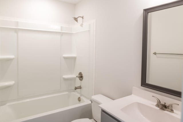 full bath featuring toilet, washtub / shower combination, and vanity