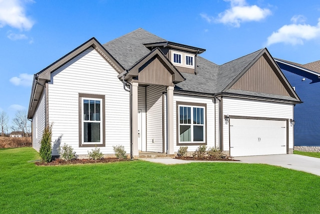 view of front of property featuring a garage and a front yard