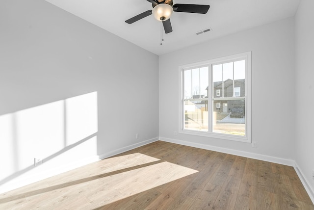 spare room featuring ceiling fan and light hardwood / wood-style floors