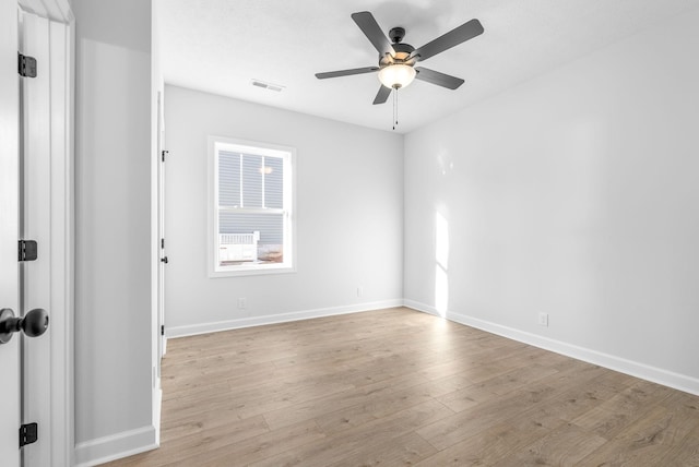 spare room featuring ceiling fan and light wood-type flooring