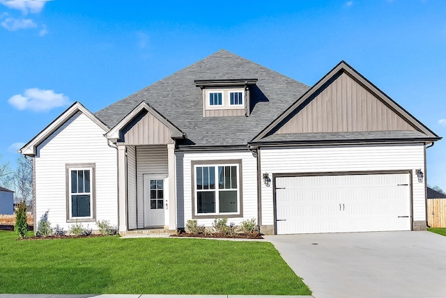 view of front of house featuring a garage and a front yard