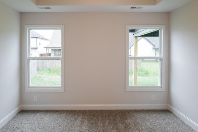 unfurnished room with light carpet, baseboards, and visible vents