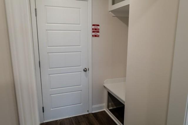 mudroom with dark wood-style flooring