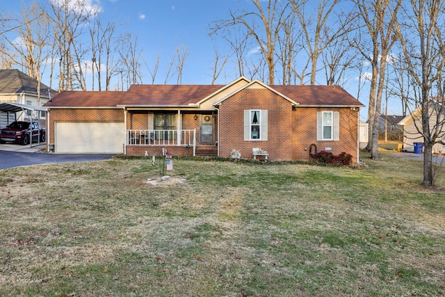 ranch-style house featuring a front lawn, a carport, and covered porch