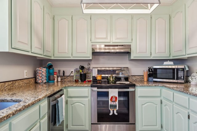 kitchen with appliances with stainless steel finishes and light stone counters