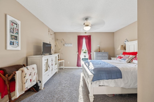 carpeted bedroom featuring a textured ceiling and ceiling fan