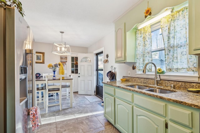 kitchen with sink, a wealth of natural light, green cabinetry, and high end fridge