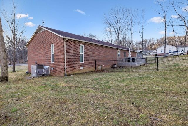 view of property exterior with cooling unit and a lawn