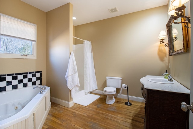 full bathroom featuring toilet, separate shower and tub, wood-type flooring, and vanity