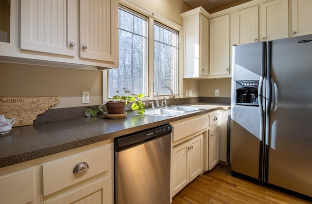 kitchen featuring sink, stainless steel appliances, and light wood-type flooring