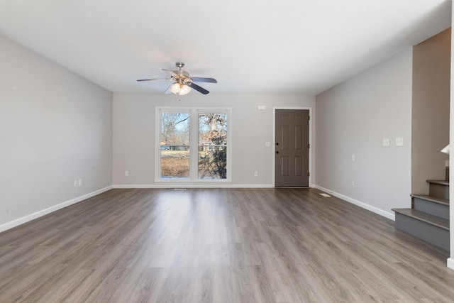 unfurnished living room with ceiling fan and light hardwood / wood-style floors