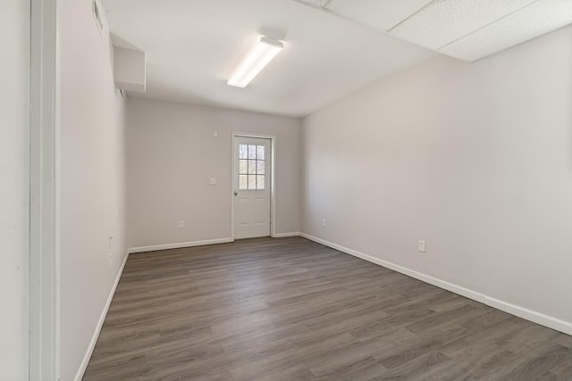 unfurnished room featuring dark hardwood / wood-style floors