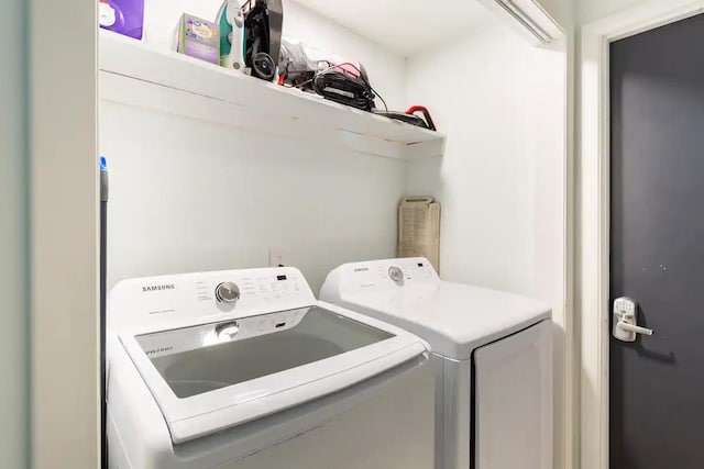 laundry area featuring washing machine and clothes dryer