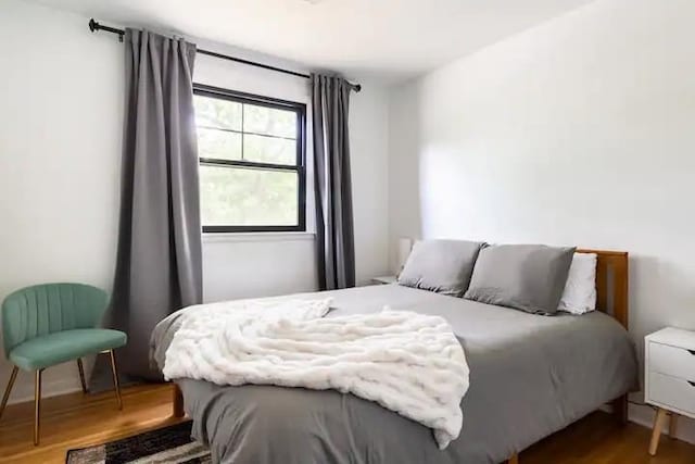 bedroom featuring wood-type flooring