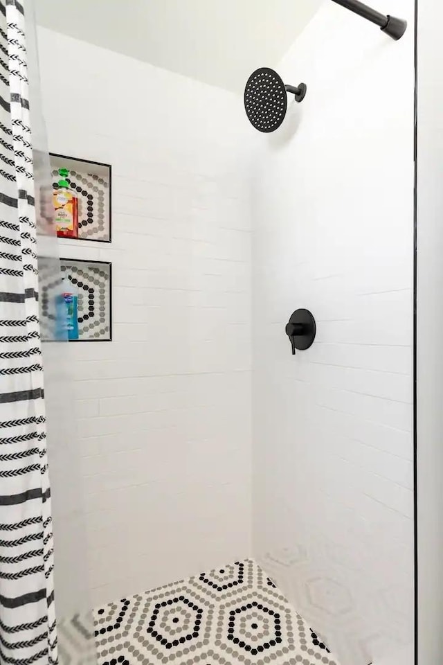 bathroom with a shower with shower curtain