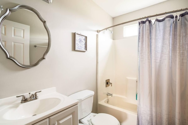 full bathroom featuring toilet, shower / bath combo, and vanity