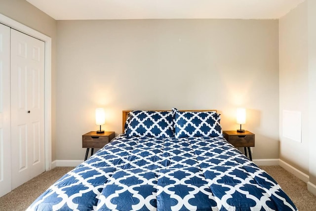 bedroom featuring a closet and carpet flooring