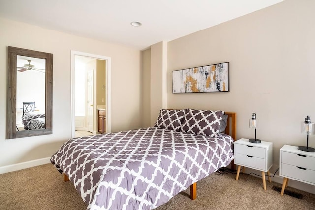 carpeted bedroom featuring ensuite bath