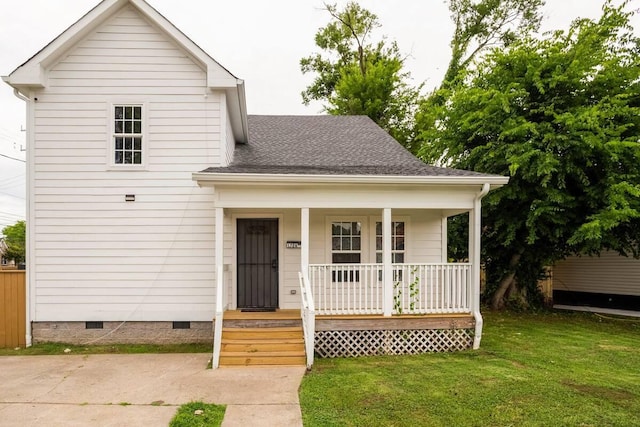 view of front of property with a front yard and a porch