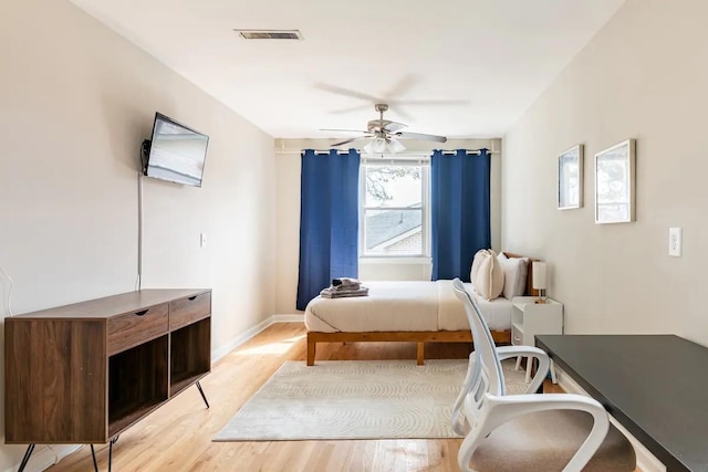 bedroom featuring ceiling fan and light hardwood / wood-style flooring