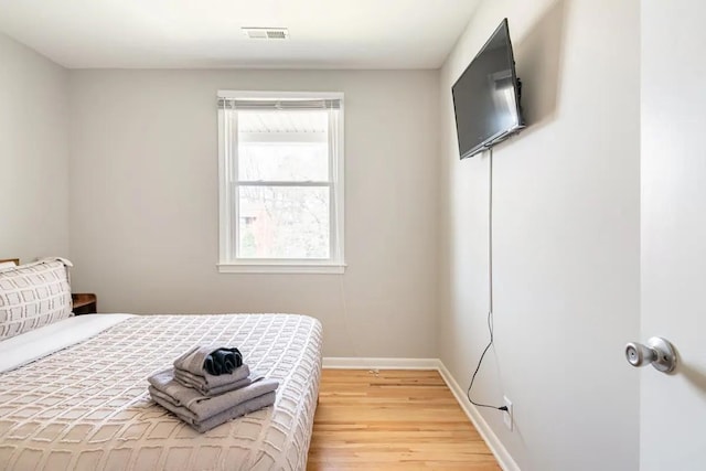 bedroom with light hardwood / wood-style flooring