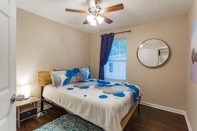 bedroom with ceiling fan and dark hardwood / wood-style floors