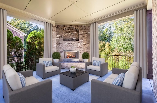 sunroom featuring an outdoor brick fireplace