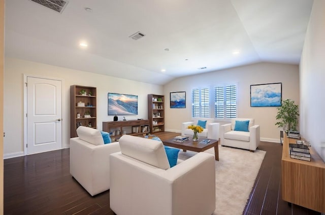 living room with lofted ceiling and dark hardwood / wood-style floors