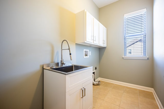 washroom with hookup for a washing machine, cabinets, hookup for an electric dryer, and plenty of natural light