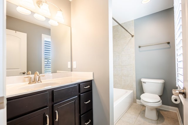 full bathroom with toilet, tile patterned floors, a wealth of natural light, and vanity