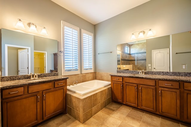 bathroom with tile patterned flooring, plus walk in shower, and vanity