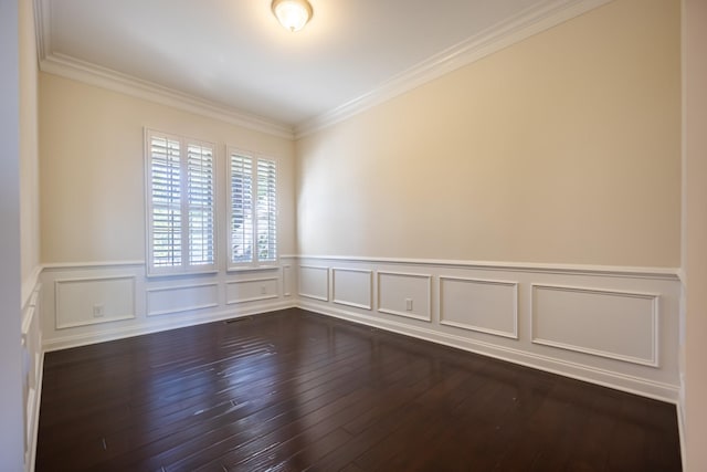 spare room with crown molding and dark hardwood / wood-style floors