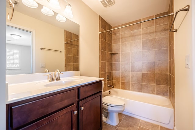 full bathroom with tile patterned floors, toilet, vanity, and tiled shower / bath