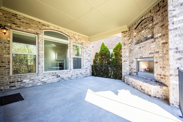 view of patio / terrace with an outdoor brick fireplace