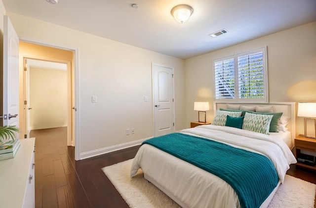 bedroom featuring dark hardwood / wood-style floors