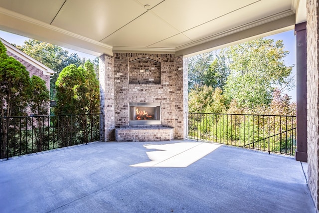 view of patio with an outdoor brick fireplace