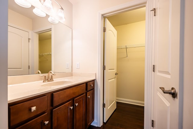 bathroom with vanity and hardwood / wood-style flooring