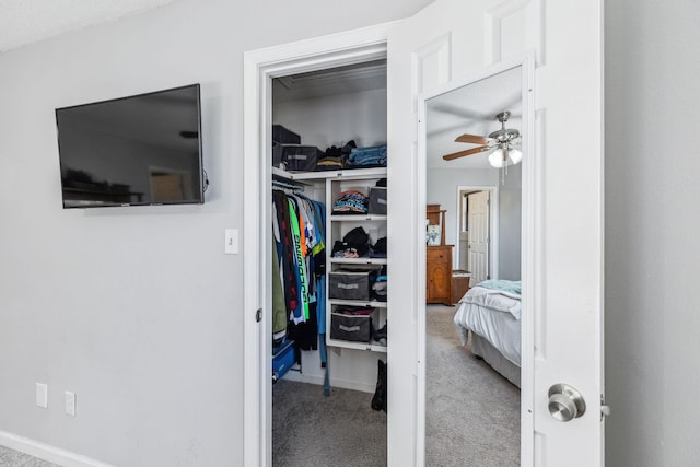 interior space featuring ceiling fan and light carpet