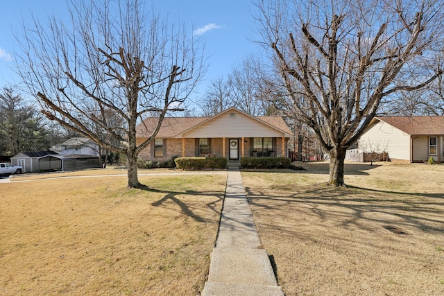 ranch-style house with covered porch and a front yard