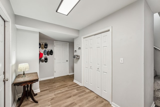 corridor featuring light hardwood / wood-style floors