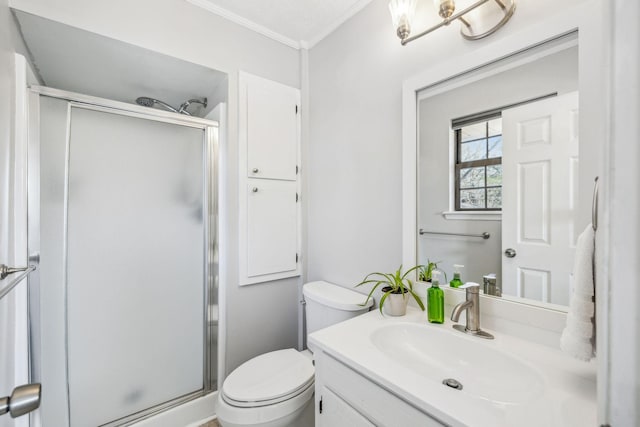 bathroom with a textured ceiling, ornamental molding, toilet, walk in shower, and vanity