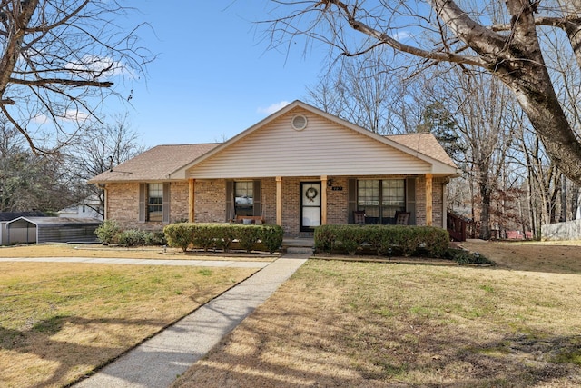 view of front of house with a front yard and a porch